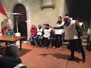 Locals in Pienza take part in a panforte tossing competition